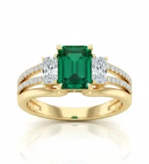 Stunning 18K Emerald Diamond Ring in yellow gold with emerald cut center and side diamonds