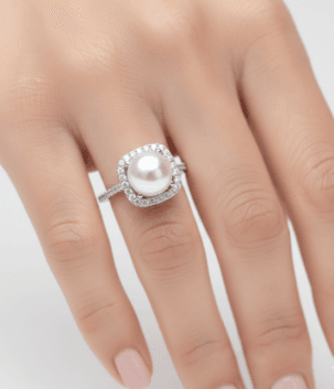 Classic pearl ring with white stones on band
