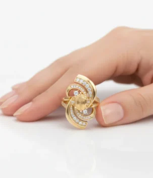 Gold swirl diamond ring with oval center stone and accent diamonds