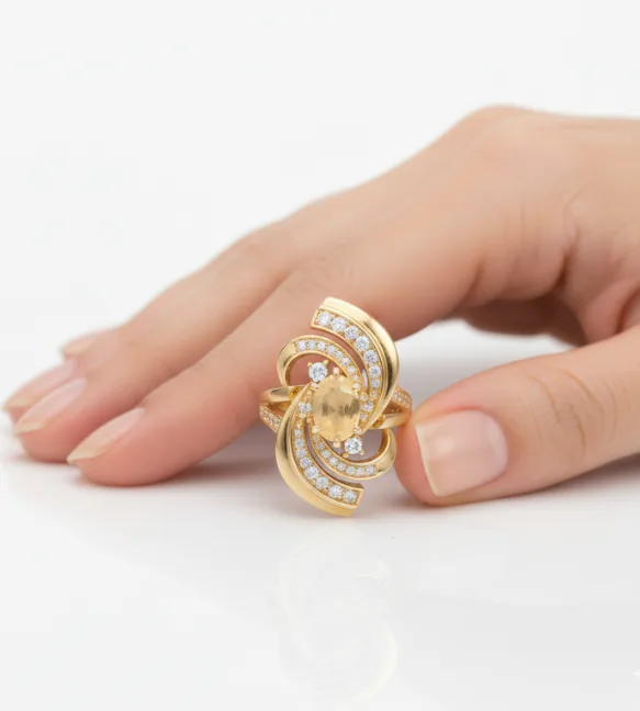 Gold swirl diamond ring with oval center stone and accent diamonds